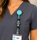 Teal and Black "Be Kind" Badge Reel